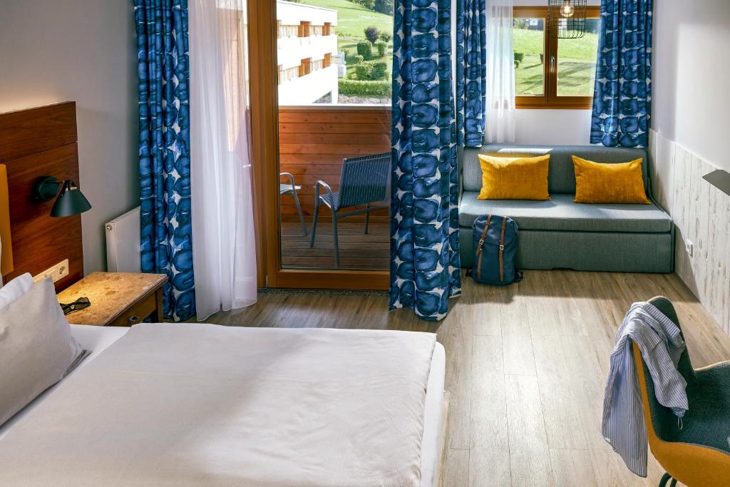 Postel nebo postele na pokoji v ubytování TUI BLUE Fieberbrunn