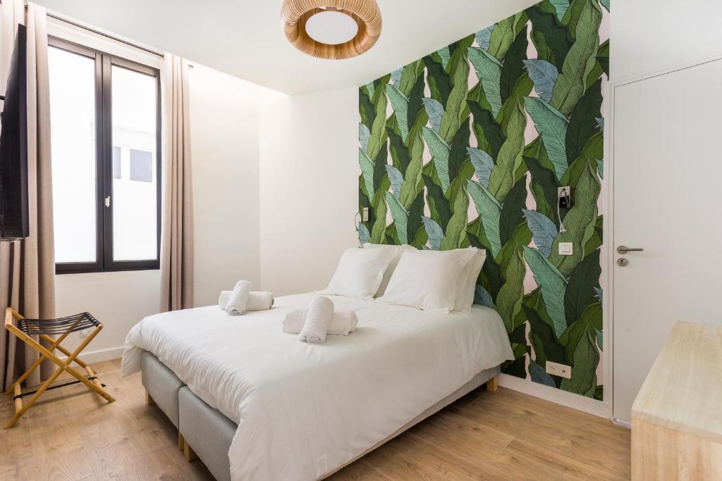 HSH Saint-Sauveur Luxury Apartment 8P-3BR tesisinde bir odada yatak veya yataklar