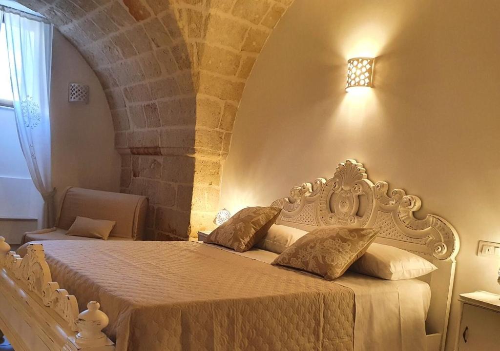 A bed or beds in a room at Dimora del ciliegino
