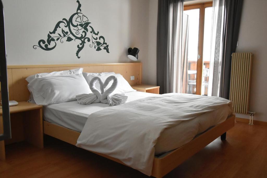 Postel nebo postele na pokoji v ubytování Hotel Principe Marmolada
