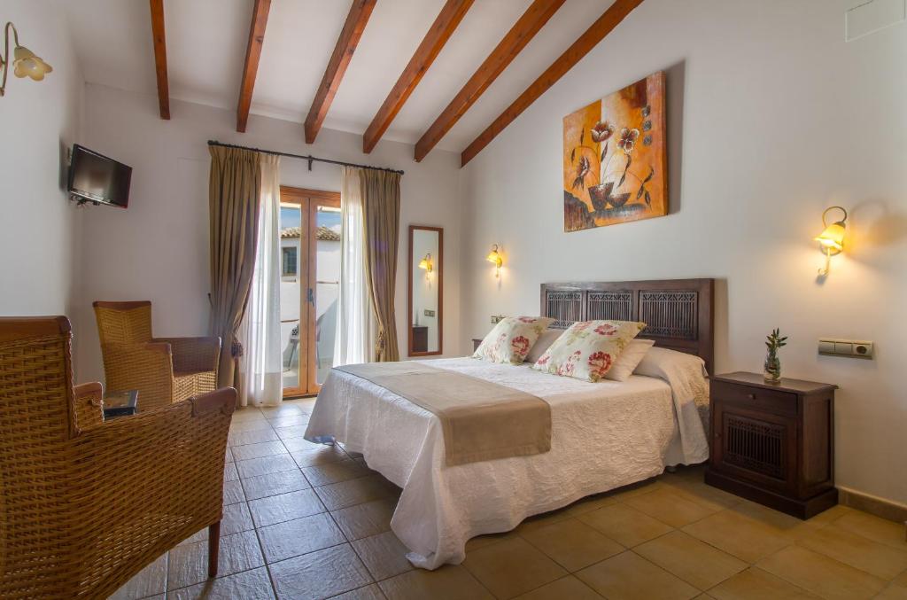 a bedroom with a bed in a room at Hotel Tossal d'Altea in Altea