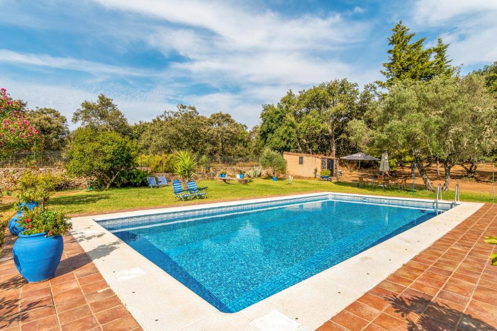 an image of a swimming pool in a yard at 4 bedrooms villa with private pool and enclosed garden at Cortegana in Cortegana