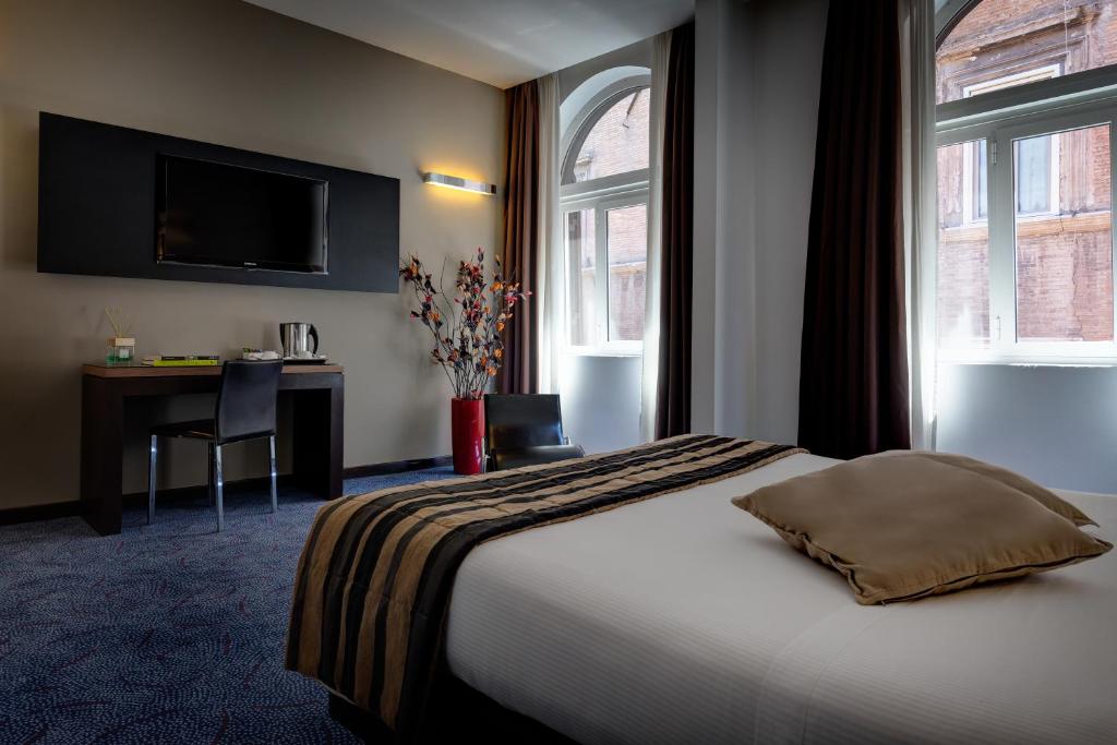 Postel nebo postele na pokoji v ubytování Hotel Rinascimento - Gruppo Trevi Hotels