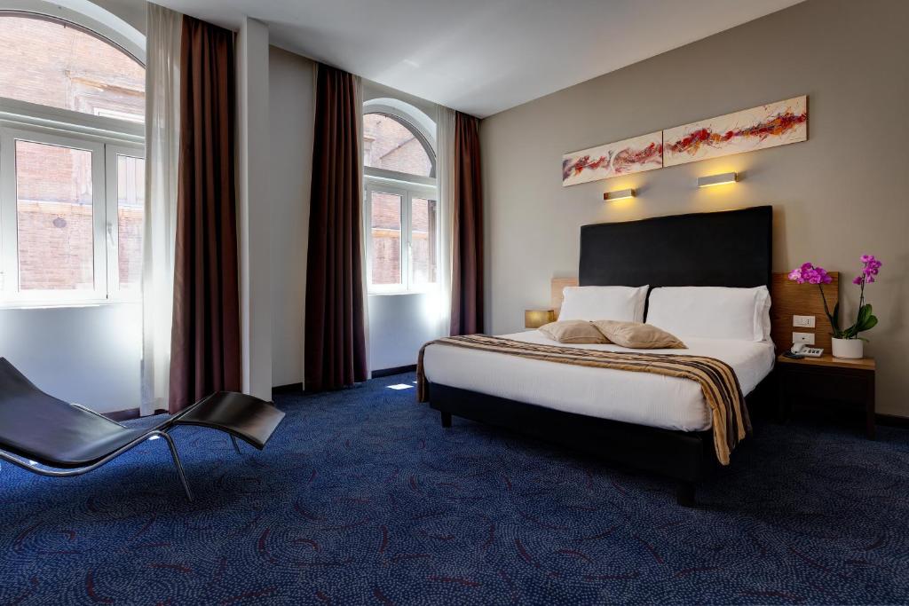 Postel nebo postele na pokoji v ubytování Hotel Rinascimento - Gruppo Trevi Hotels