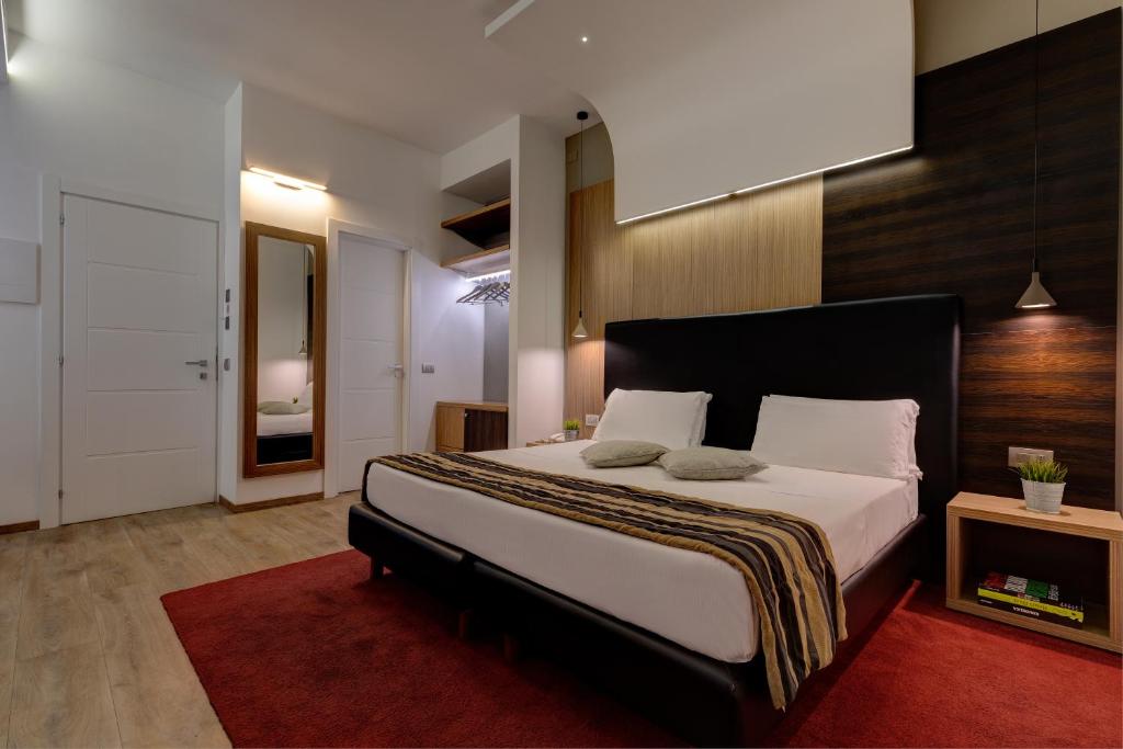 Postel nebo postele na pokoji v ubytování Hotel Rinascimento - Gruppo Trevi Hotels