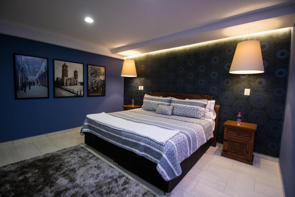 Giường trong phòng chung tại Hotel Santa Rosa by Rotamundos