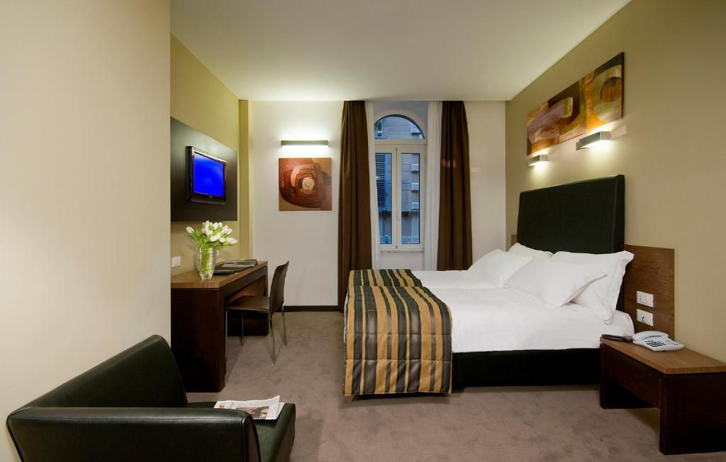 Postel nebo postele na pokoji v ubytování Hotel Rinascimento - Gruppo Trevi Hotels