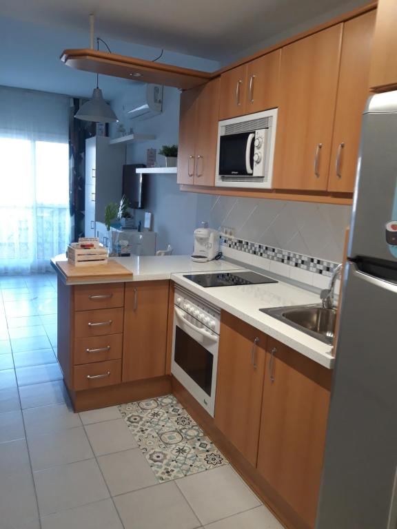 Kuchyň nebo kuchyňský kout v ubytování Benalbeach Holidays Benalmâdena