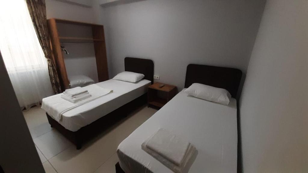Postel nebo postele na pokoji v ubytování Yeşilyurt otel