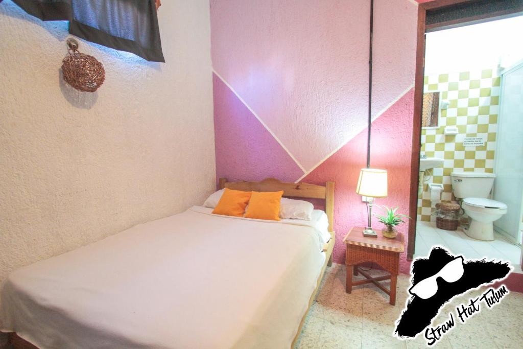 A bed or beds in a room at Straw Hat Hostel & Rooftop Bar