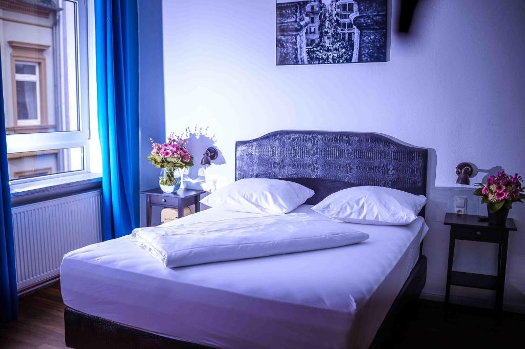 Postel nebo postele na pokoji v ubytování SmartHotel Mystique Self check-in