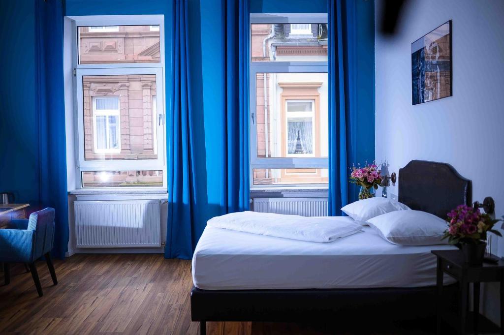 Postel nebo postele na pokoji v ubytování SmartHotel Mystique Self check-in