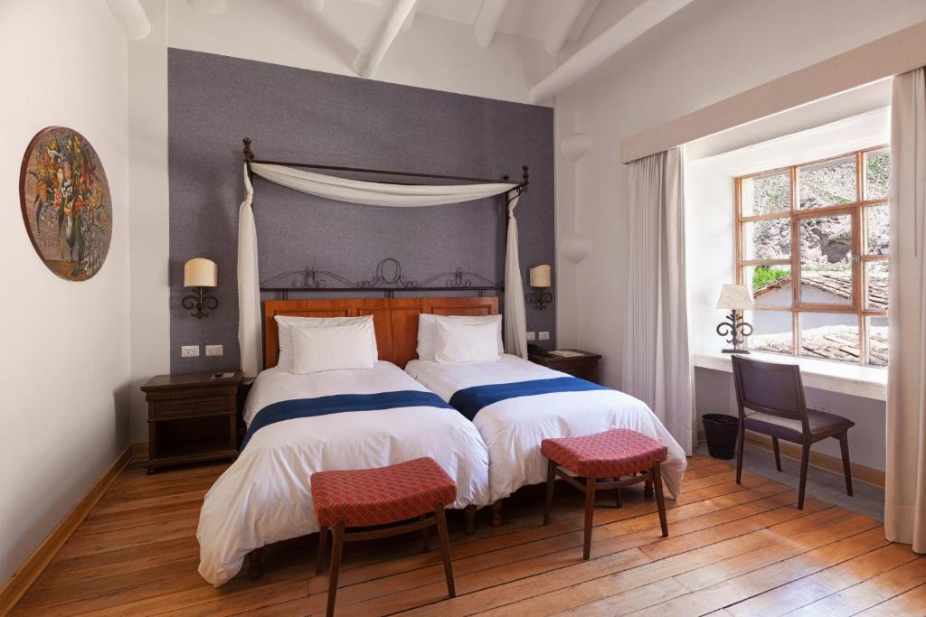 Postel nebo postele na pokoji v ubytování Hotel La Casona De Yucay Valle Sagrado