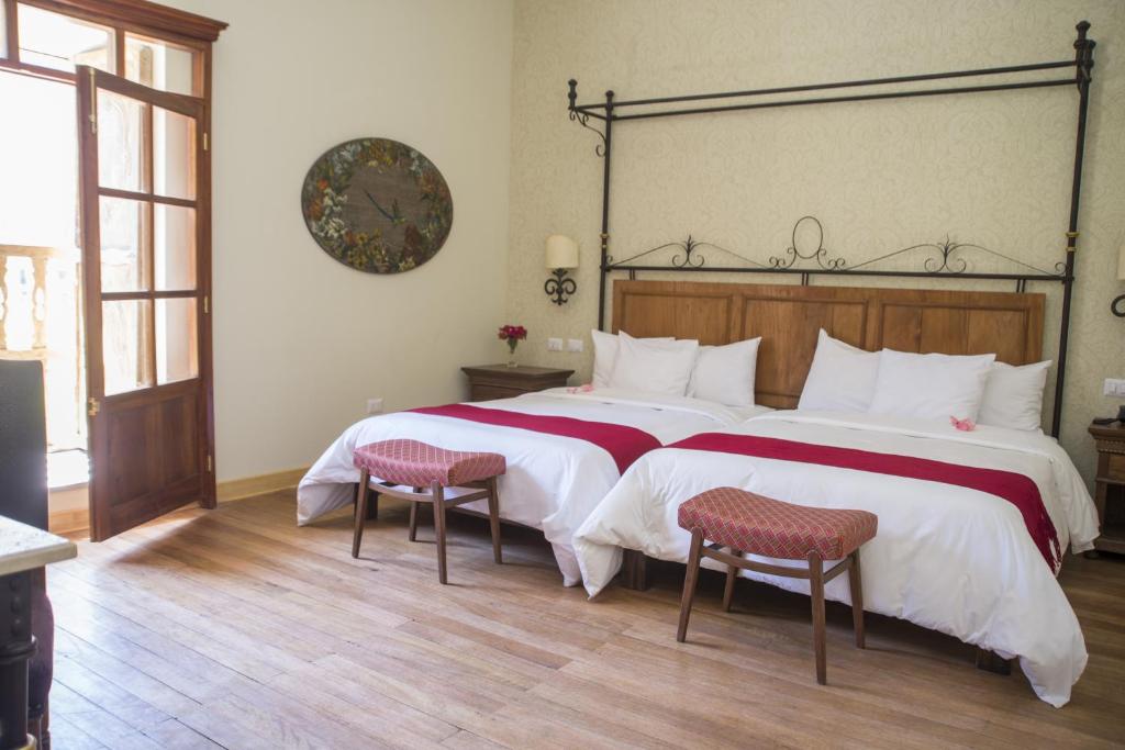 Postel nebo postele na pokoji v ubytování Hotel La Casona De Yucay Valle Sagrado