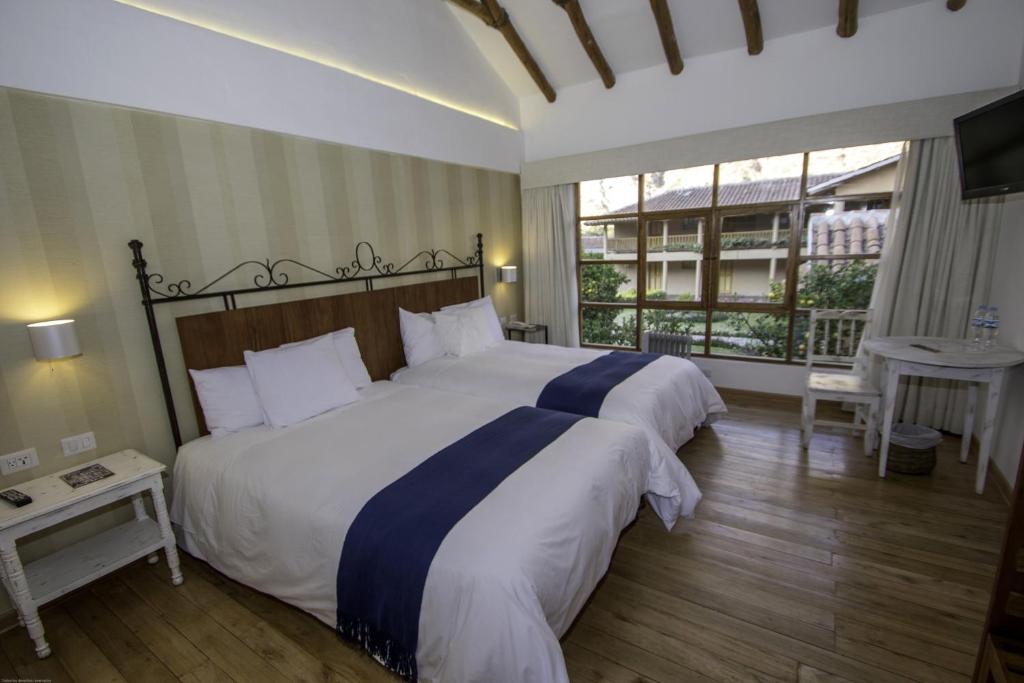 Postel nebo postele na pokoji v ubytování Hotel La Casona De Yucay Valle Sagrado