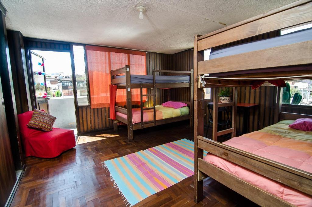 Postel nebo postele na pokoji v ubytování Arequipay Hostel
