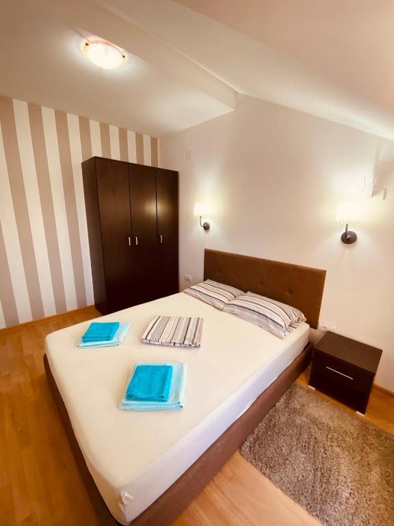 Postel nebo postele na pokoji v ubytování Apartmani borova 2