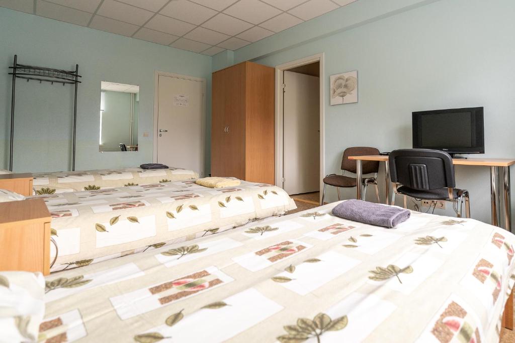 Postel nebo postele na pokoji v ubytování Virumaa Hostel