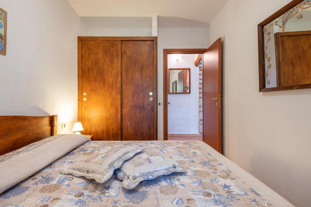 Łóżko lub łóżka w pokoju w obiekcie Villa Mallus 4 posti letto