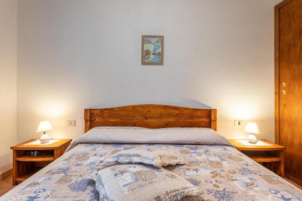 Łóżko lub łóżka w pokoju w obiekcie Villa Mallus 4 posti letto