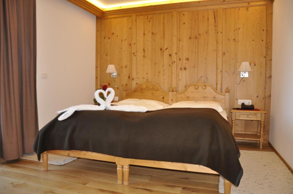 Voodi või voodid majutusasutuse Hotel Rosengarten toas