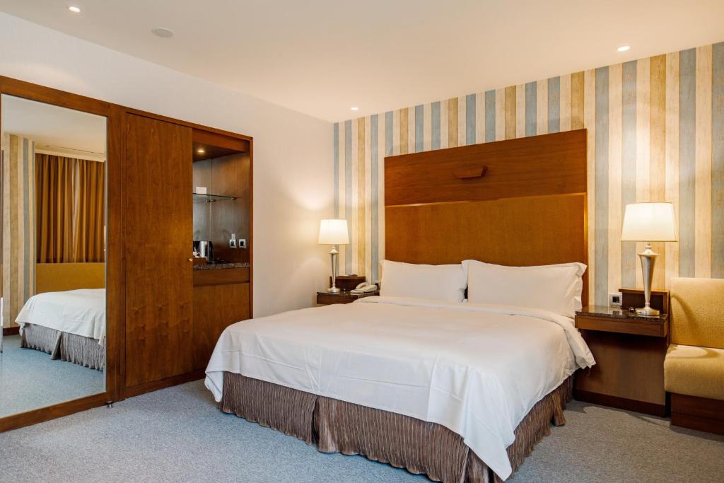 Postel nebo postele na pokoji v ubytování Hotel HD Palace