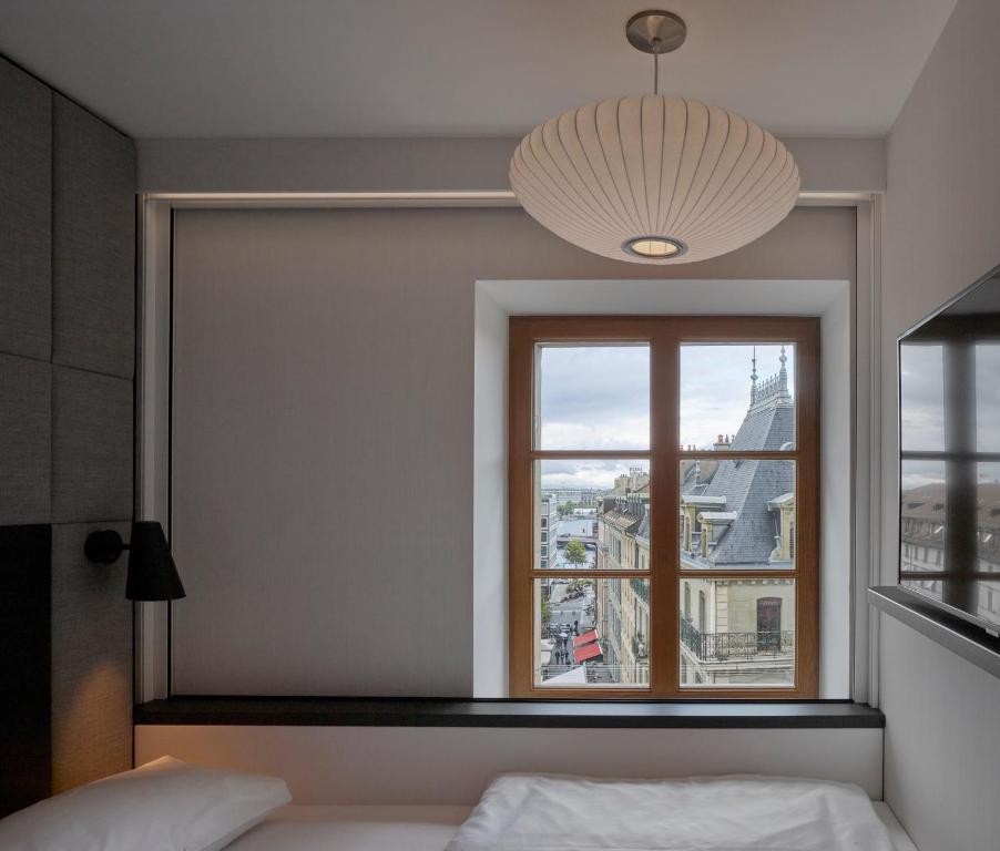 Postel nebo postele na pokoji v ubytování citizenM Geneva