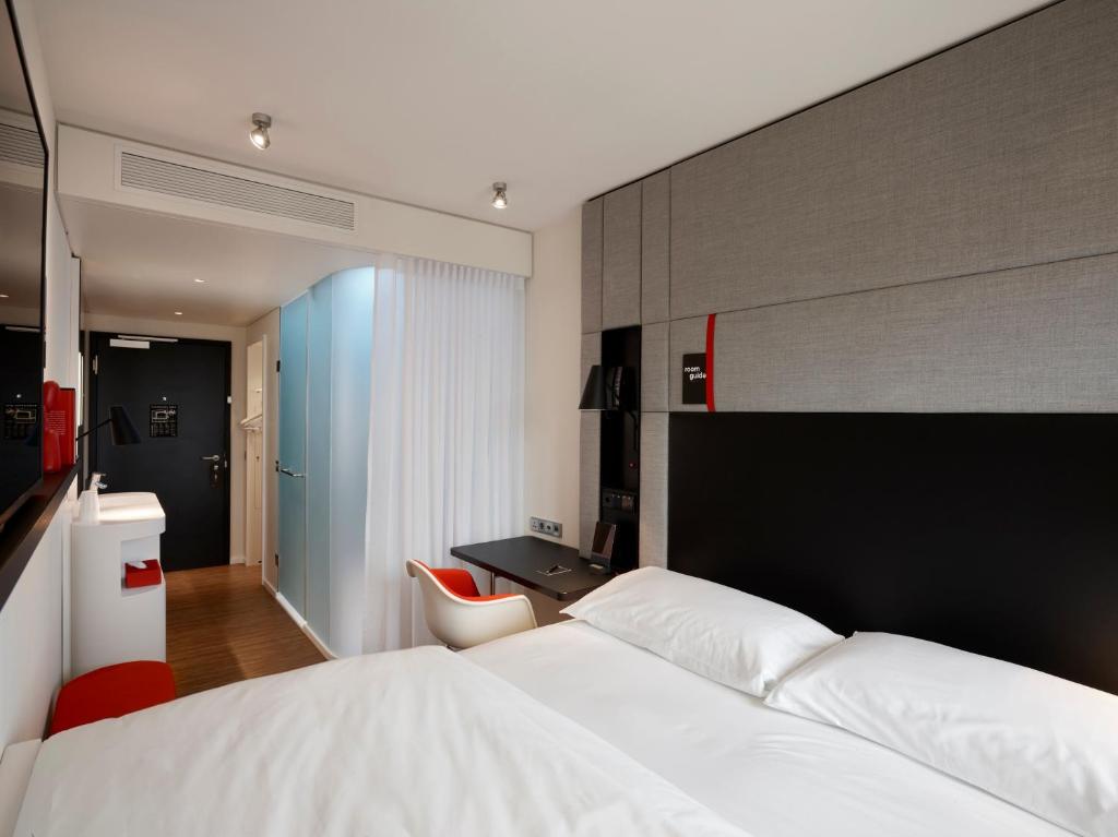 Postel nebo postele na pokoji v ubytování citizenM Geneva