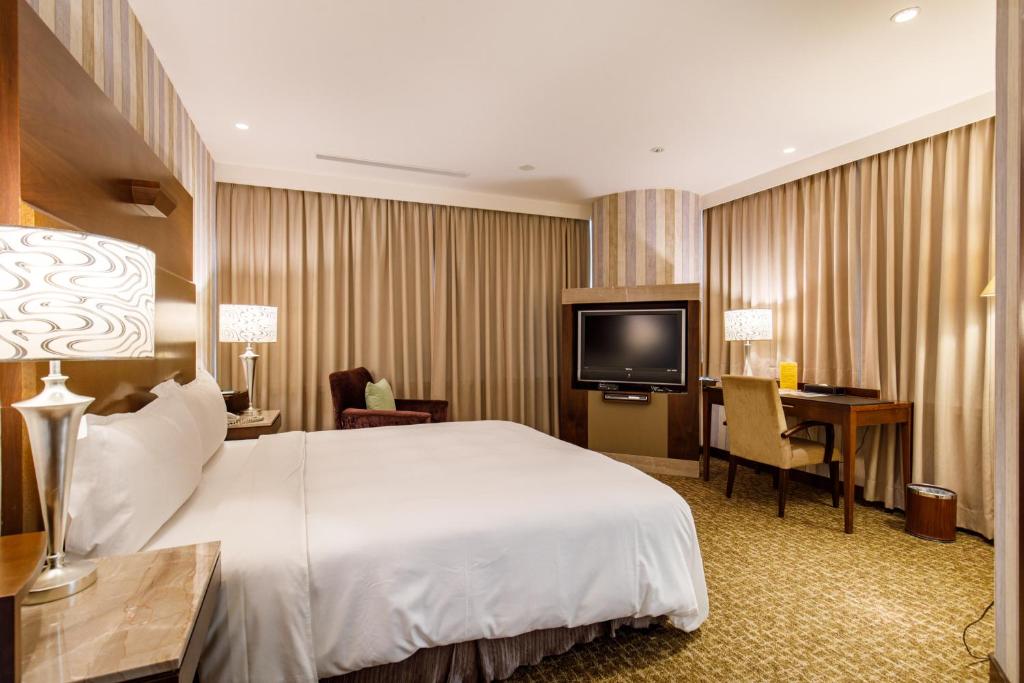 Postel nebo postele na pokoji v ubytování Hotel HD Palace