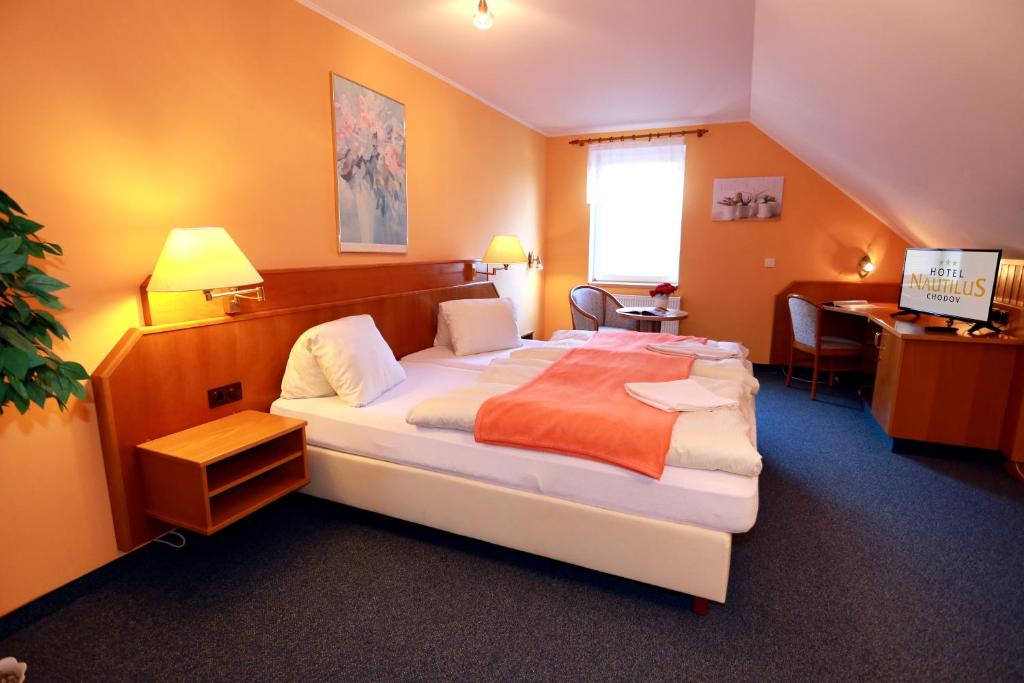 Voodi või voodid majutusasutuse hotel Nautilus toas