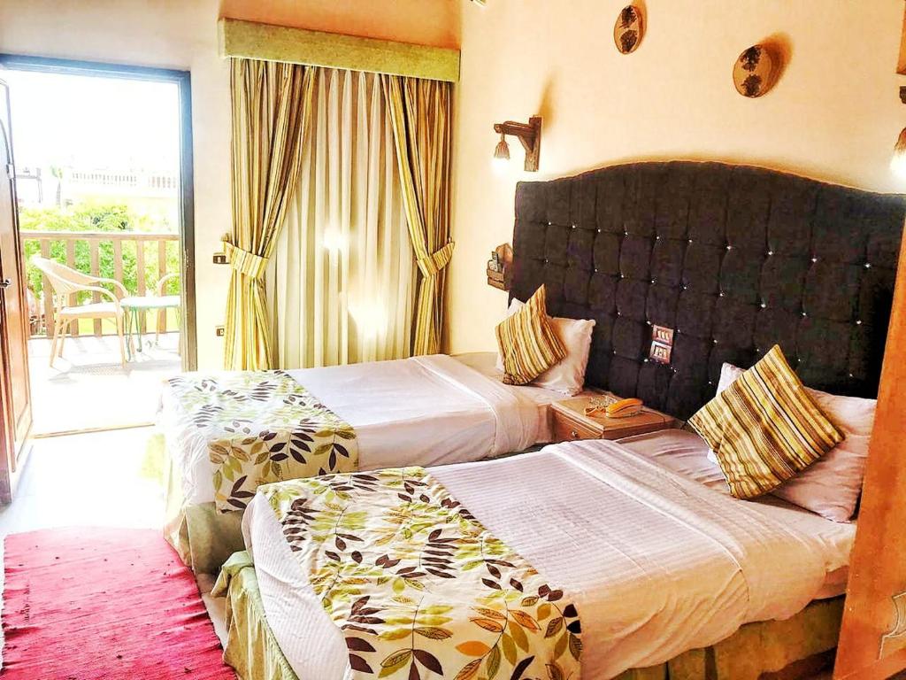 Postel nebo postele na pokoji v ubytování Ganet Sinai Resort