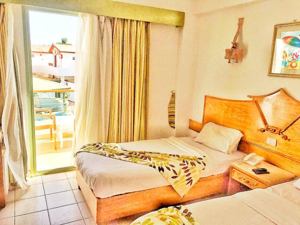 Postel nebo postele na pokoji v ubytování Ganet Sinai Resort