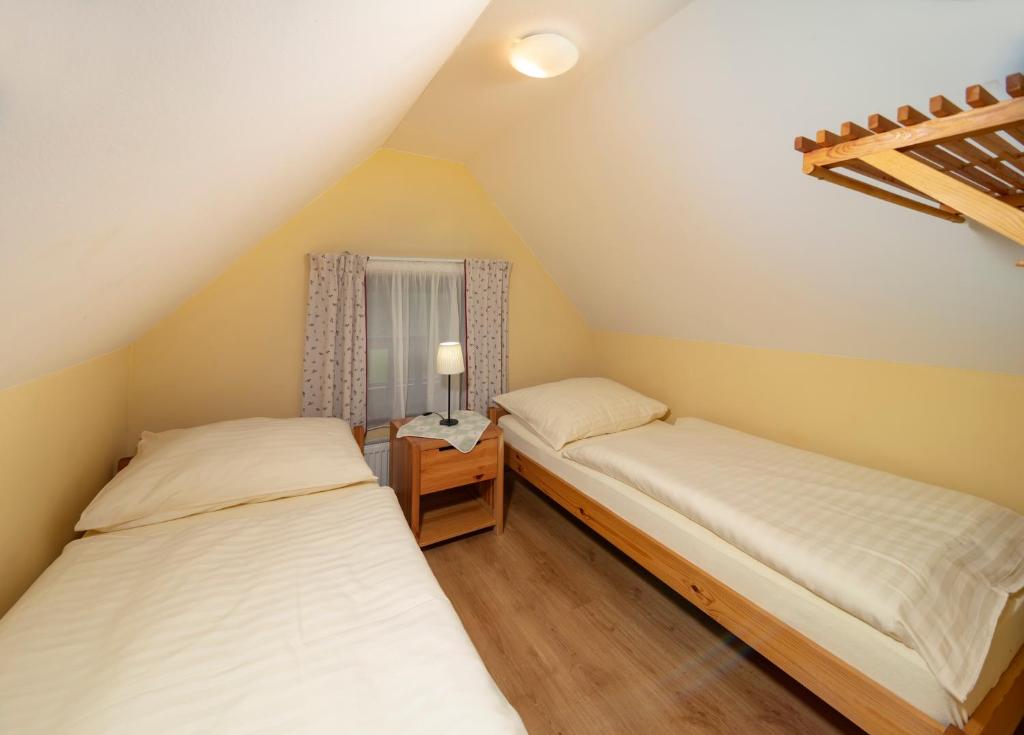 Postel nebo postele na pokoji v ubytování Pension Aspen