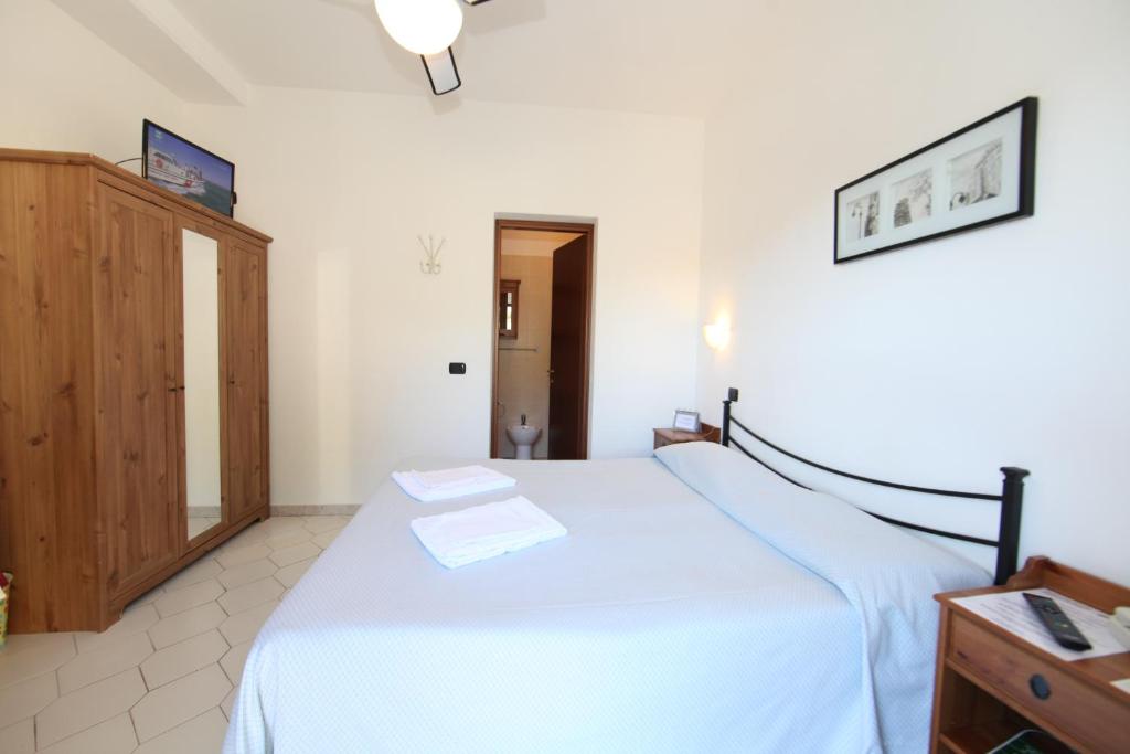 Postel nebo postele na pokoji v ubytování Hotel Villa Wanda
