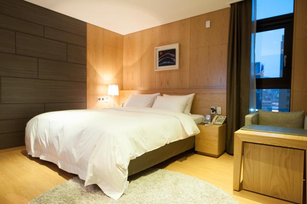 Postel nebo postele na pokoji v ubytování Rian Hotel