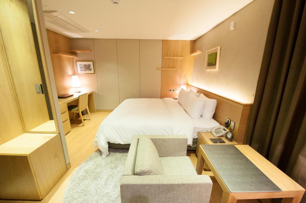Postel nebo postele na pokoji v ubytování Rian Hotel