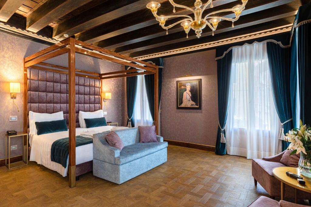 Postel nebo postele na pokoji v ubytování Hotel Donà Palace