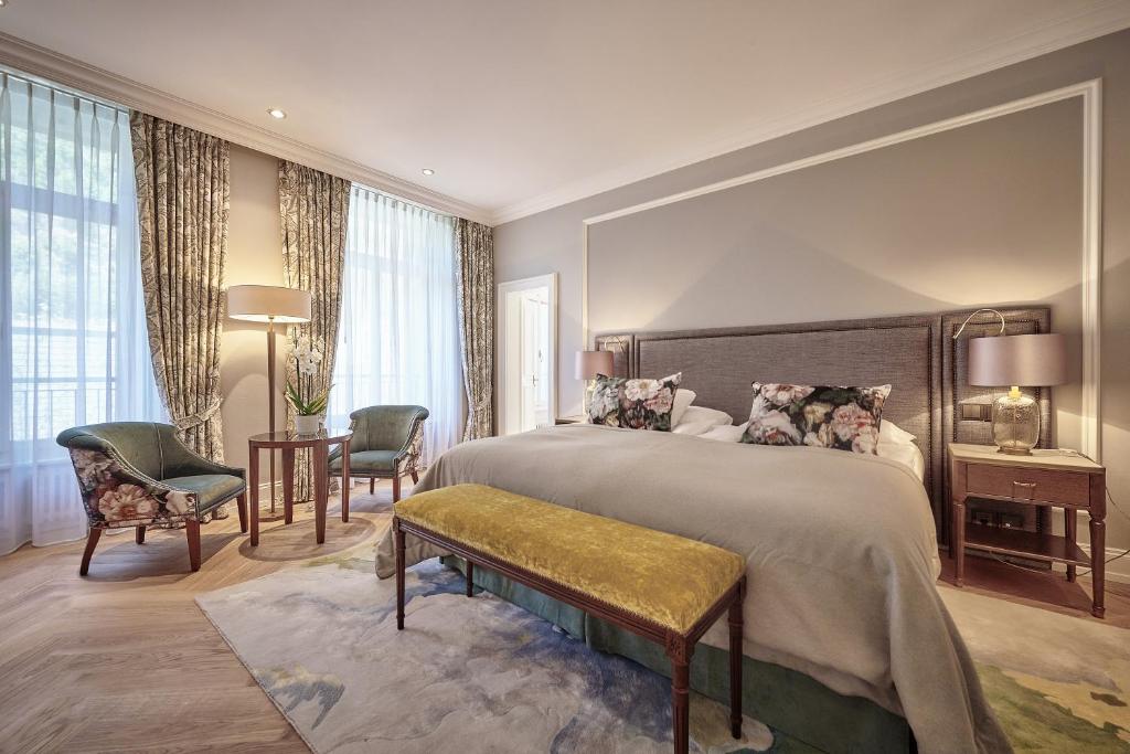 Postel nebo postele na pokoji v ubytování Victoria Jungfrau Grand Hotel & Spa