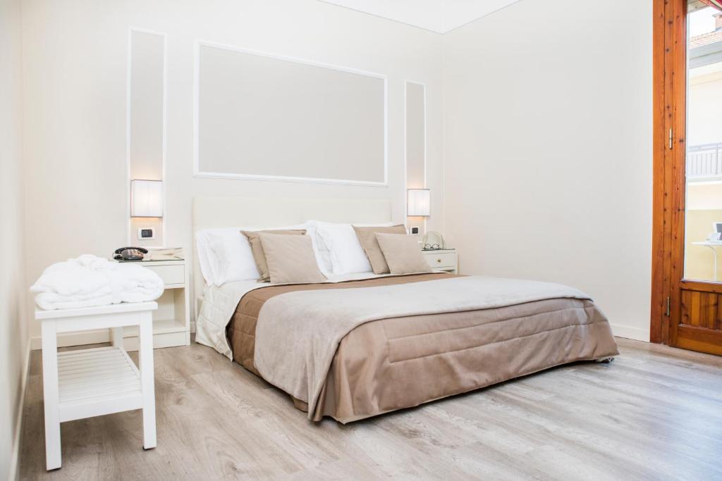 Postel nebo postele na pokoji v ubytování Hotel Ariston & Spa