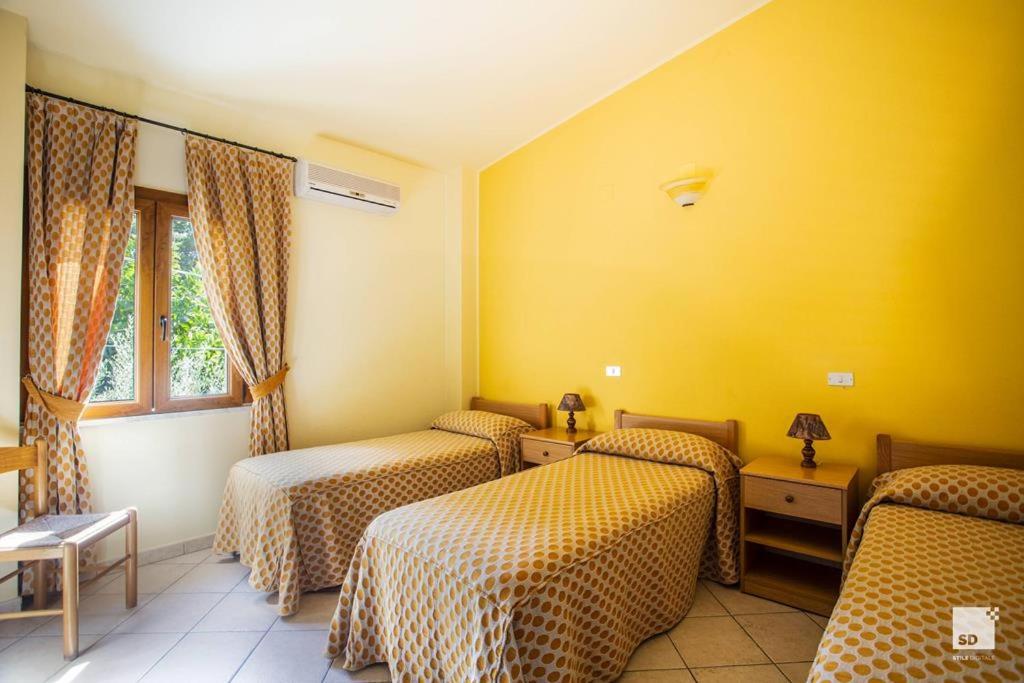 Postel nebo postele na pokoji v ubytování Tonicello Hotel Resort & SPA