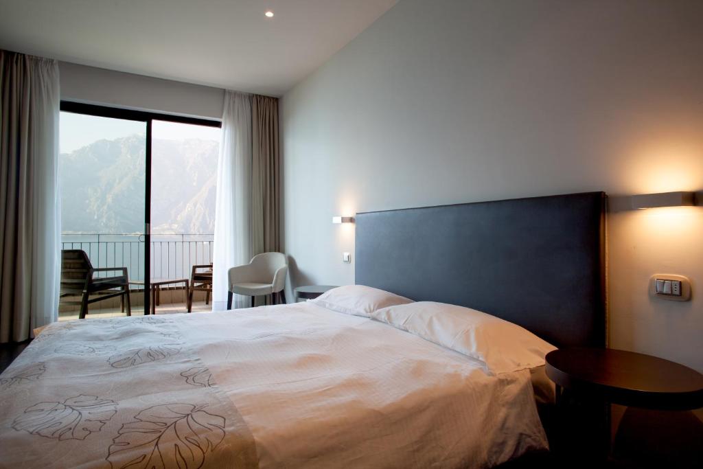 Postel nebo postele na pokoji v ubytování Piccolo Hotel