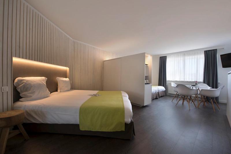 Postel nebo postele na pokoji v ubytování Flanders Hotel