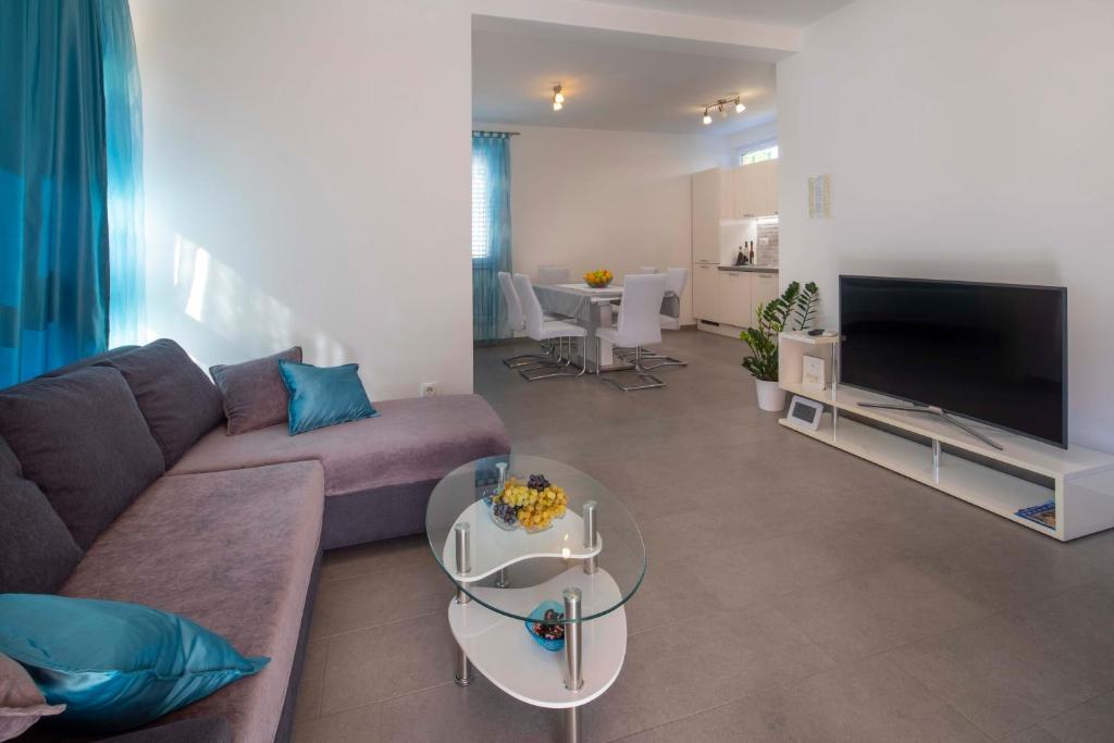 TV a/nebo společenská místnost v ubytování Apartment Fragola
