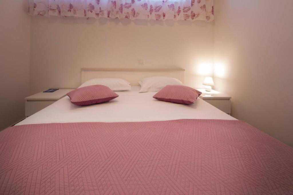 Postel nebo postele na pokoji v ubytování Apartment Fragola