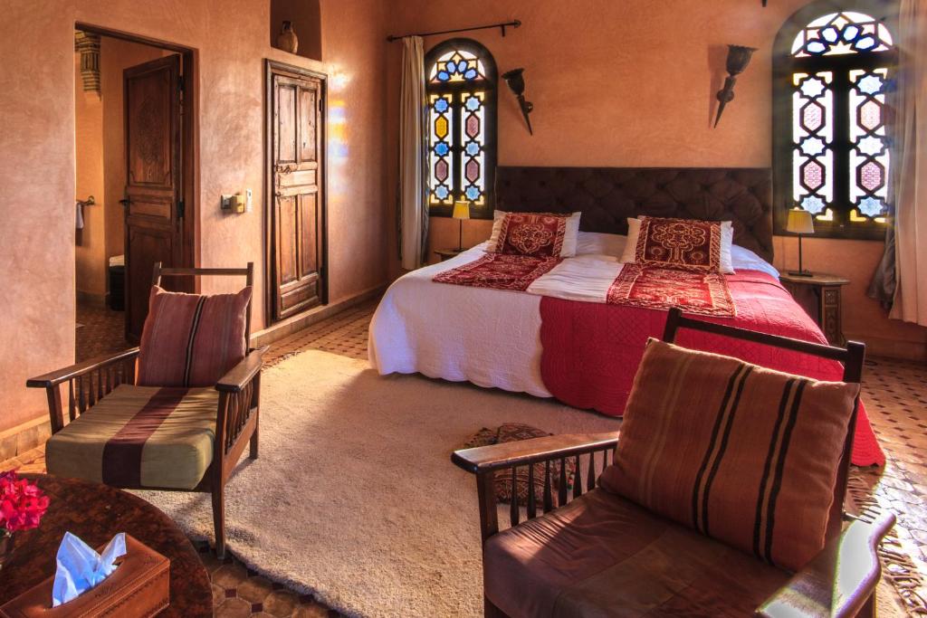 Una cama o camas en una habitación de Kasbah Tabelkoukt