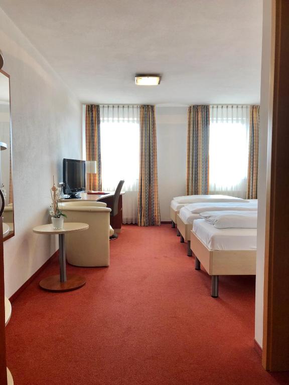 Postel nebo postele na pokoji v ubytování Hotel Günter