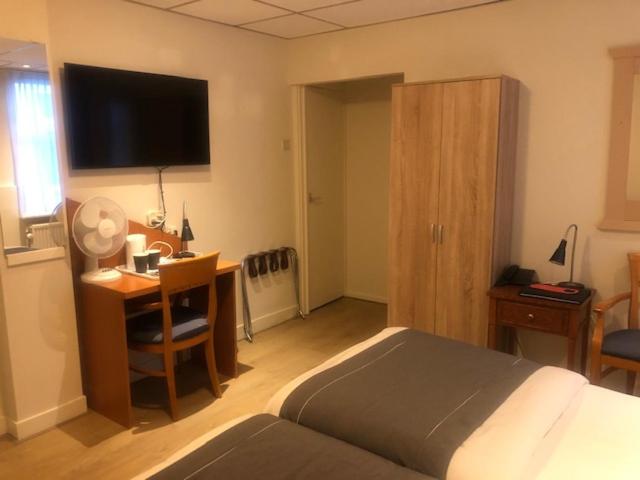 Postel nebo postele na pokoji v ubytování Delta Hotel City Center