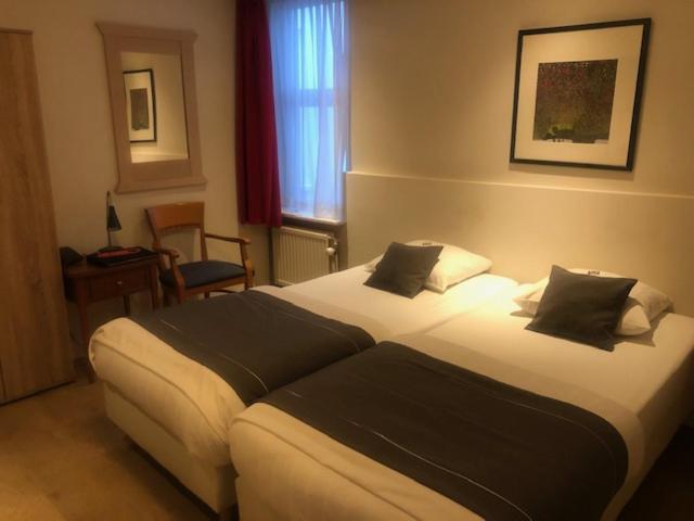 Postel nebo postele na pokoji v ubytování Delta Hotel City Center