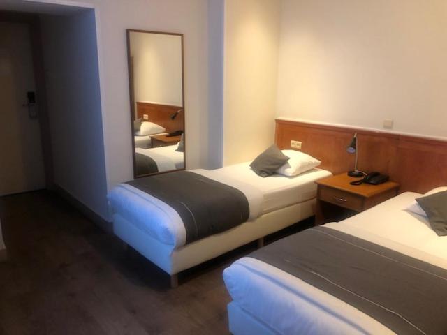Postel nebo postele na pokoji v ubytování Delta Hotel City Center
