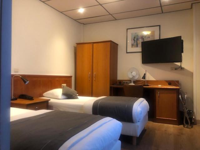 Postel nebo postele na pokoji v ubytování Delta Hotel City Center